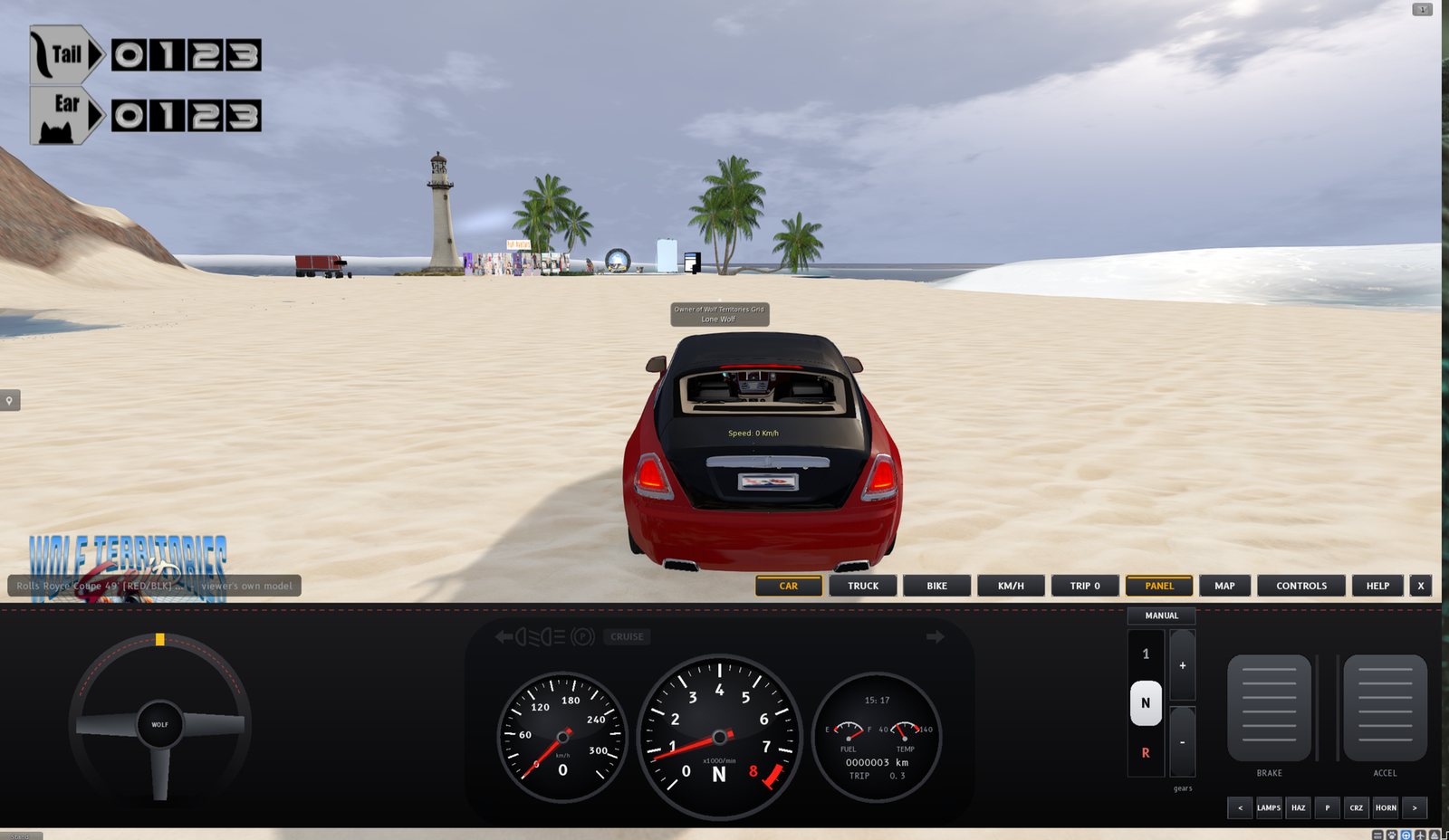 A red Rolls-Royce coupe seen from behind on a sandy beach on the Sandbox region, with a lighthouse and palm trees ahead. Across the bottom of the screen is the car dashboard: a steering wheel on the left, three round dials in the middle (speedometer, rev counter showing N, and a fuel, temperature and odometer dial), a MANUAL gear lever with 1, N and R, brake and accelerator pedals, and a row of lamp buttons. Above it on the right are the CAR, TRUCK, BIKE, KM/H, TRIP 0, PANEL, MAP, CONTROLS, HELP and X buttons.